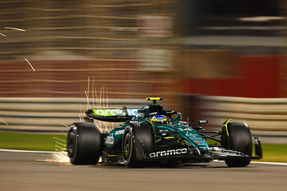 BAHRAIN, BAHRAIN - FEBRUARY 23: Sparks fly behind Fernando Alonso of Spain driving the (14) Aston Martin AMR24 Mercedes during day three of F1 Testing at Bahrain International Circuit on February 23, 2024 in Bahrain, Bahrain. (Photo by Clive Mason/Getty Images)