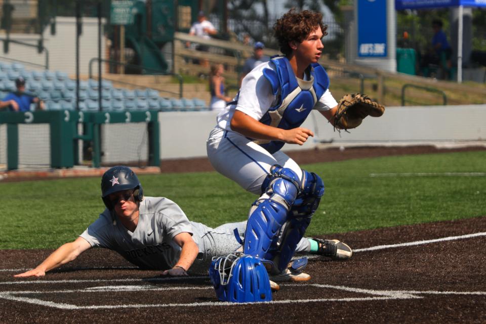 Shelby County’s Myles Strong slides into home against Eastern’s Mark Harmon in the Clark's Pump-N-Shop Baseball State Tournament on June 3, 2023.