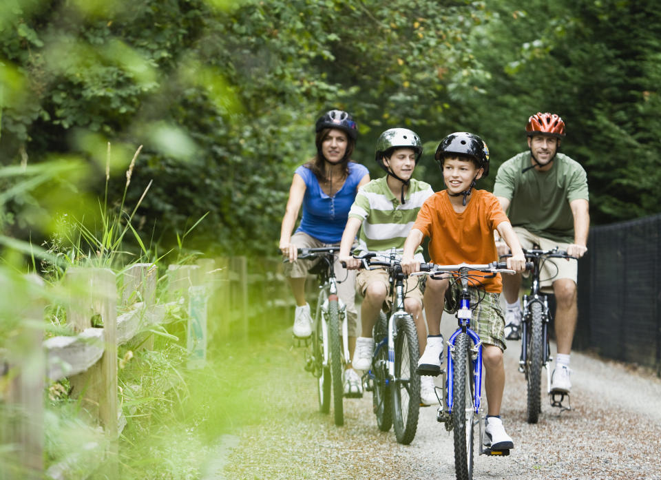 Family riding together outdoors. Source: Getty Images