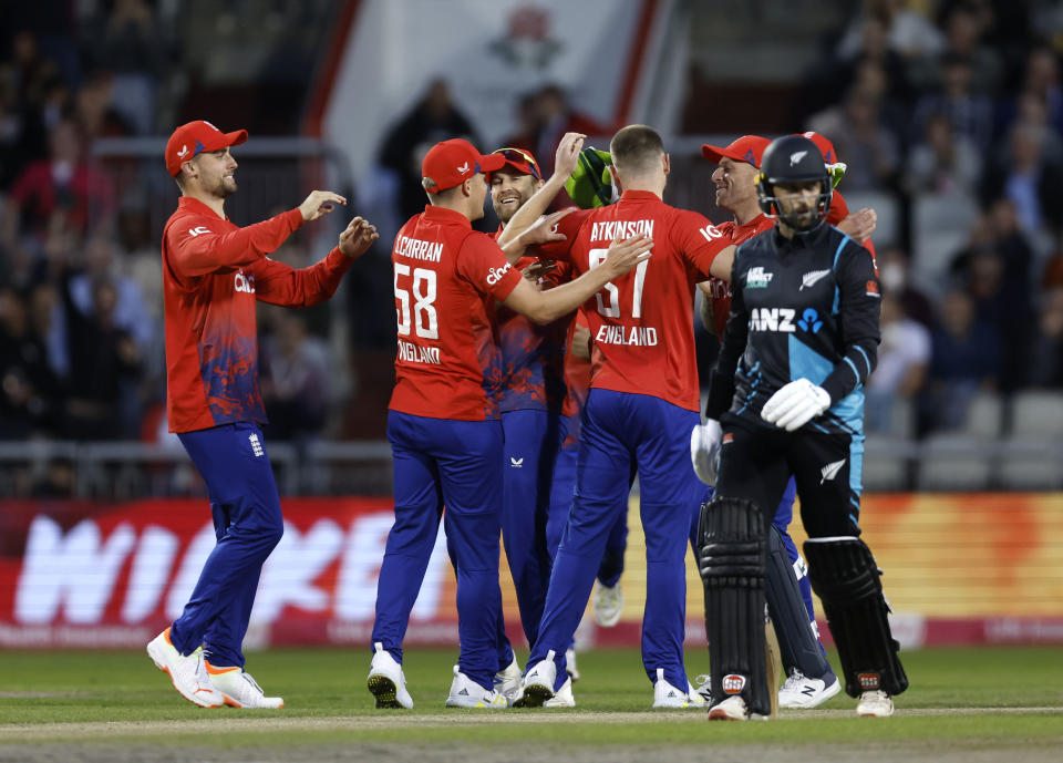 England's Gus Atkinson celebrates the wicket of New Zealand's Devon Conway during the IT20 match between England and New Zealand at Emirates Old Trafford, Manchester, England, Friday Sept. 1, 2023. (Nigel French/PA via AP)