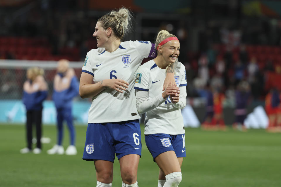 England's Millie Bright, left, celebrate with England's Chloe Kelly after the Women's World Cup Group D soccer match between China and England in Adelaide, Australia, Tuesday, Aug. 1, 2023. (AP Photo/James Elsby)