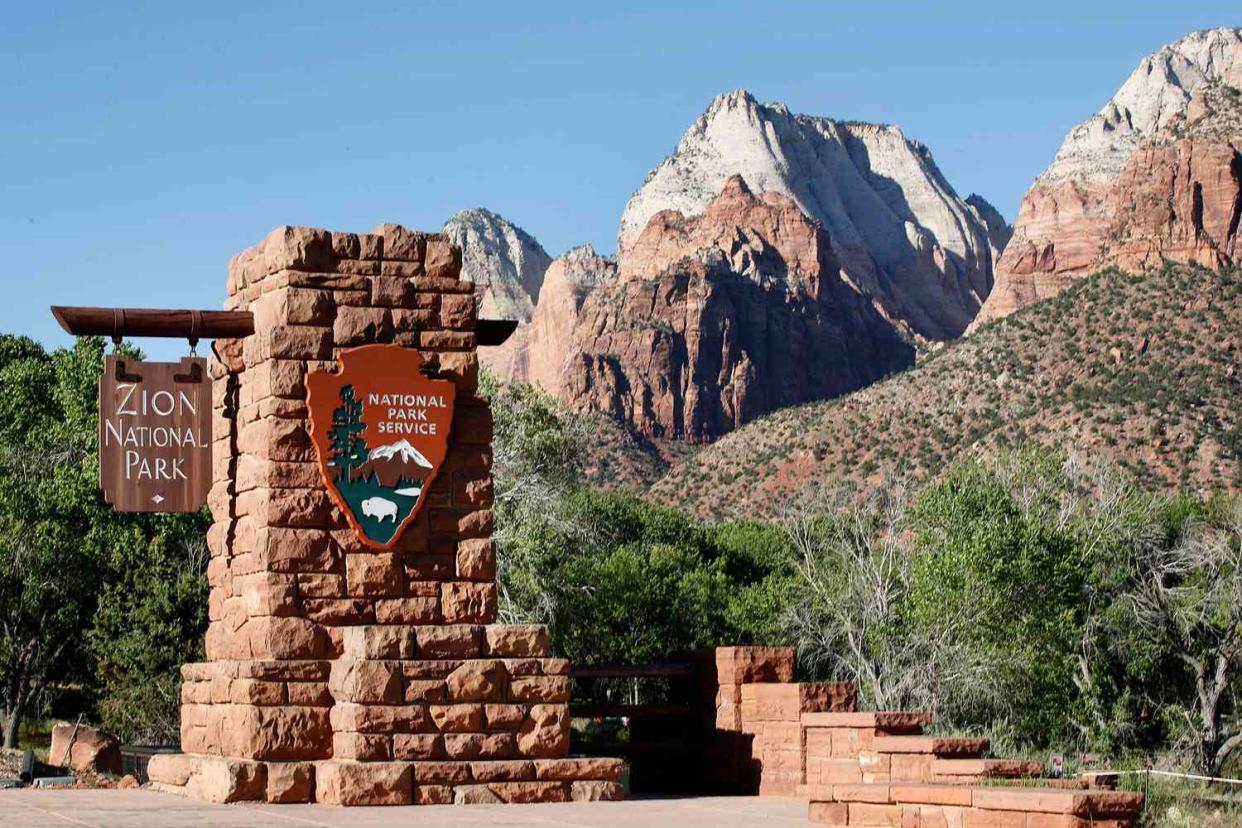 SPRINGDALE, UT - MAY 14: A sign hangs at the entrance to Zion National Park on May 14, 2020 in Springdale, Utah. Zion National Park had a limited reopening yesterday as part of its reopening plan after it was closed due to the COVID-19 pandemic. (Photo by George Frey/Getty Images)