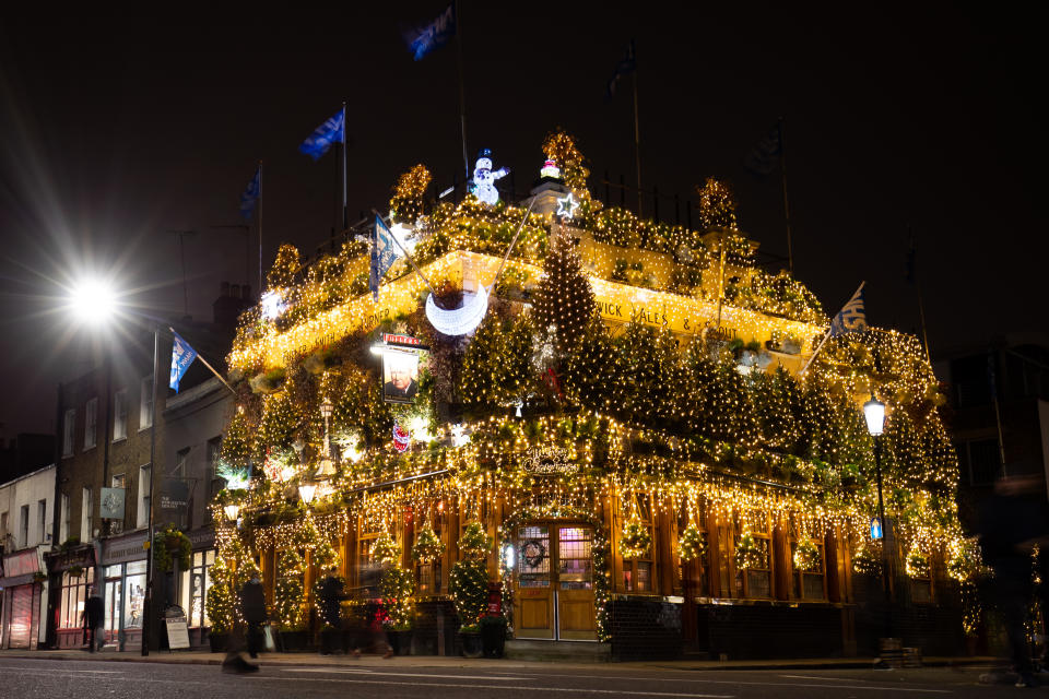 The Churchill Arms pub in London switches on its Christmas lights. (Photo by Aaron Chown/PA Images via Getty Images)