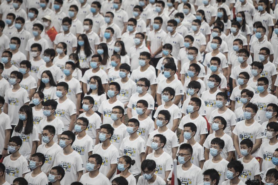 A group of seven thousand graduate students wear masks during the opening ceremony at Huazhong University of Science and Technology on Sept. 4, 2020 in Wuhan, Hubei province, China.