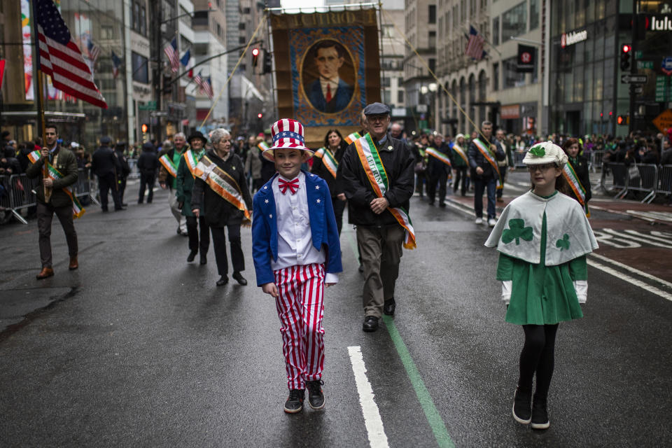 FILE - Participants march up Fifth Avenue during the St. Patrick's Day Parade, Thursday, March 17, 2022, in New York. The day honoring the patron saint of Ireland is a global celebration of Irish heritage. And nowhere is that more so than in the United States, where parades take place in cities around the country and all kinds of foods and drinks are given an emerald hue. (AP Photo/Eduardo Munoz Alvarez, File)