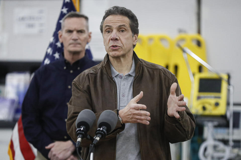 New York Gov. Andrew Cuomo speaks during a news conference alongside the National Guard at the Jacob Javits Center that will house a temporary hospital in response to the COVID-19 outbreak, Monday, March 23, 2020, in New York. New York City hospitals are just 10 days from running out of "really basic supplies," Mayor Bill de Blasio said late Sunday. De Blasio has called upon the federal government to boost the city's quickly dwindling supply of protective equipment. The city also faces a potentially deadly dearth of ventilators to treat those infected by the coronavirus. (AP Photo/John Minchillo)