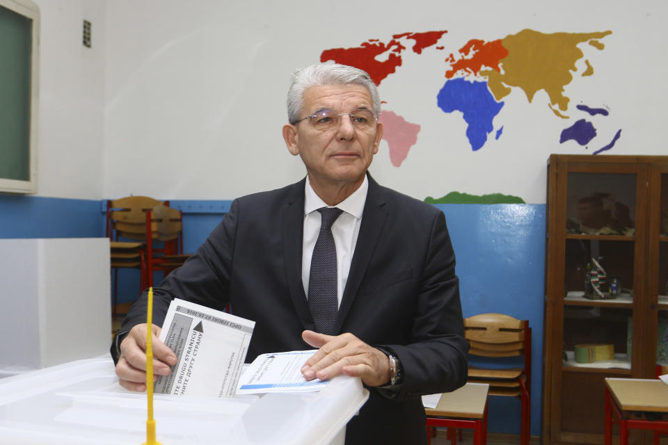 Bosnian Muslim candidate for Bosnian Presidency, Party for Democratic Action (SDA), Sefik Dzaferovic cast his vote at a polling station in Zenica, 100 kms. (62 miles) north of Sarajevo, Bosnia, on Sunday, Oct. 7, 2018. Bosnians decide in a tense election this weekend whether to cement the ethnic divisions stemming from the 1992-95 war by supporting nationalist politicians or push for changes that would pave the way toward European Union and NATO integration. (AP Photo/STR)