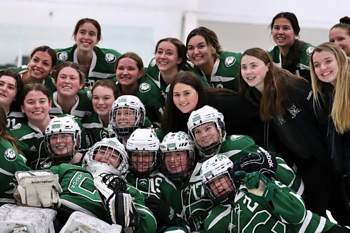 The Canton High girls hockey team celebrates winning the Final Four game against Natick in the Division 2 state tournament at Gallo Ice Arena in Bourne on Monday, March 14, 2022.