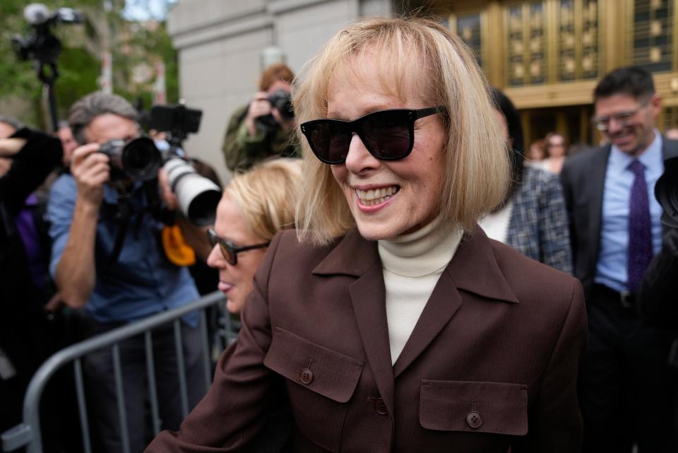 E Jean Carroll, centre, walks out of Manhattan federal court, on 9 May 2023. A jury has found Donald Trump liable for sexually abusing the advice columnist in 1996, awarding her $5m in a judgment that could haunt the former president as he campaigns to regain the White House. (AP)