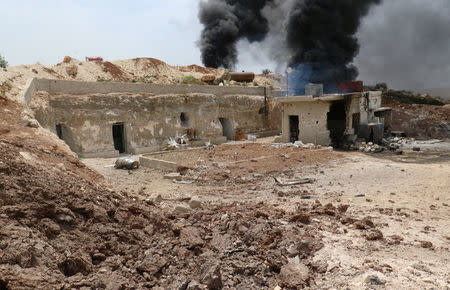 Smoke rises from an emergency service point after an airstrike at the rebel-held village of Maar Zita in Idlib province, Syria April 27, 2017. REUTERS/Ammar Abdullah