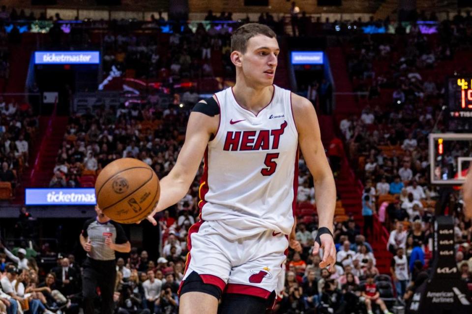Miami Heat forward <a class="link " href="https://sports.yahoo.com/nba/players/6717/" data-i13n="sec:content-canvas;subsec:anchor_text;elm:context_link" data-ylk="slk:Nikola Jovic;sec:content-canvas;subsec:anchor_text;elm:context_link;itc:0">Nikola Jovic</a> (5) dribbles the ball during the second half of an NBA game at Kaseya Center in Miami on April 12, 2024. D.A. Varela/dvarela@miamiherald.com