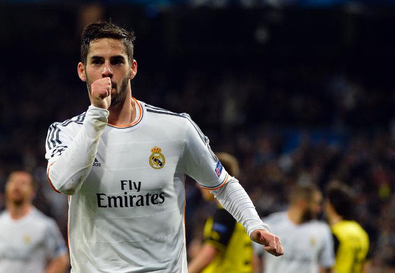 Real Madrid's midfielder Isco (C) celebrates after scoring at the Santiago Bernabeu stadium in Madrid on April 2, 2014