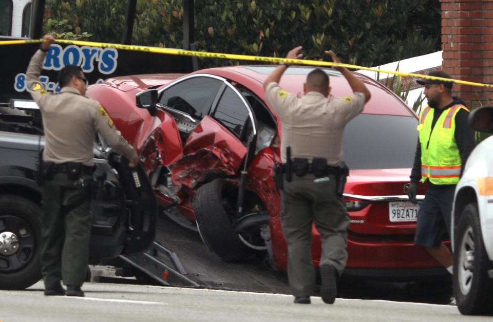 Deputies approach the scene of a multi-vehicle crash.