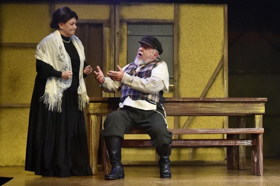 Lisa Valdiani Booth and her husband, Tod Booth, appear on stage as husband and wife Tevye and Golde during a scene from "Fiddler on the Roof" during Wednesday evening's dress rehearsal.