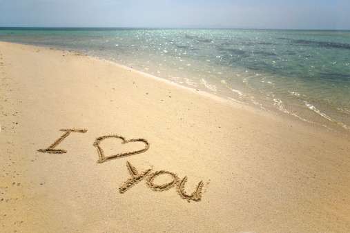 Creative ways to tell someone you love them: Write it in the sand