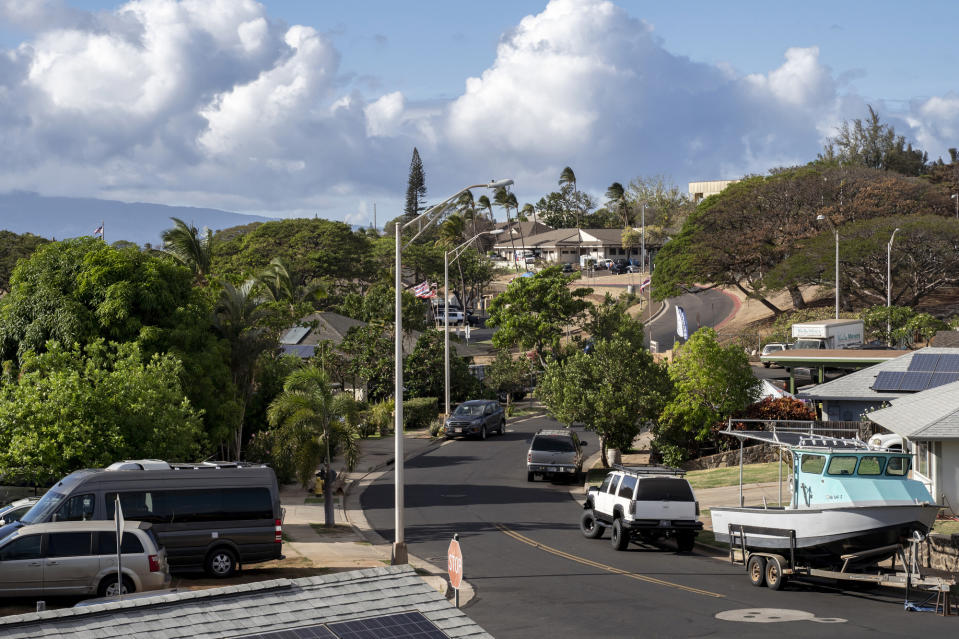 Homes on West Aipuni Place in the Villages of Leiali'i, a neighborhood in the Hawaiian home lands, on Monday, Sept. 25, 2023, in Lahaina, Hawaii. The houses in the neighborhood mostly survived a deadly August fire. (AP Photo/Mengshin Lin)