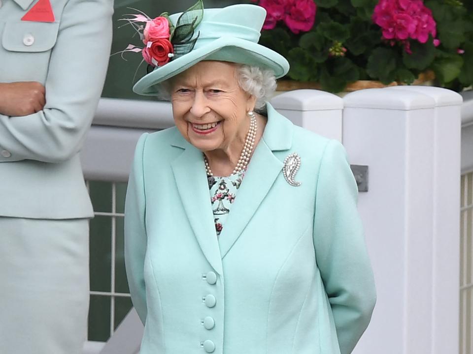 Queen Elizabeth II reacts ahead of racing on the fifth day of the Royal Ascot horse racing meet.