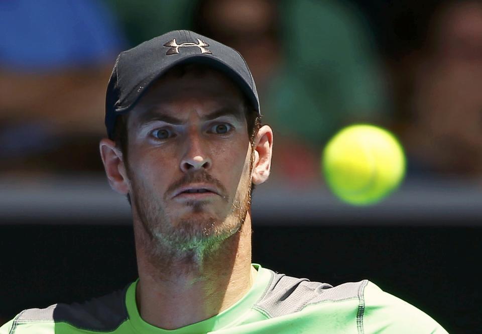 Andy Murray of Britain watches the ball as he hits a return to Marinko Matosevic of Australia during their men's singles second round match at the Australian Open 2015 tennis tournament in Melbourne January 21, 2015. REUTERS/Issei Kato (AUSTRALIA - Tags: SPORT TENNIS HEADSHOT)