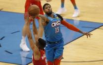Apr 19, 2019; Oklahoma City, OK, USA; Oklahoma City Thunder forward Paul George (13) and Portland Trail Blazers guard CJ McCollum (3) reach for a loose ball during the second half in game three of the first round of the 2019 NBA Playoffs at Chesapeake Energy Arena. Oklahoma City won 120-108. Mandatory Credit: Alonzo Adams-USA TODAY Sports