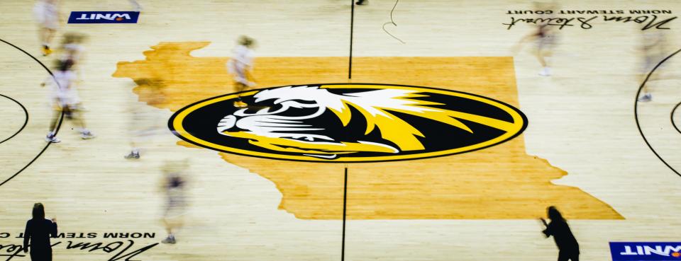 Drake and Missouri women's basketball players run across the court in a long exposure photograph during the Tigers' 83-78 loss to the Bulldogs in the first round of the WNIT on March 17 at Mizzou Arena.