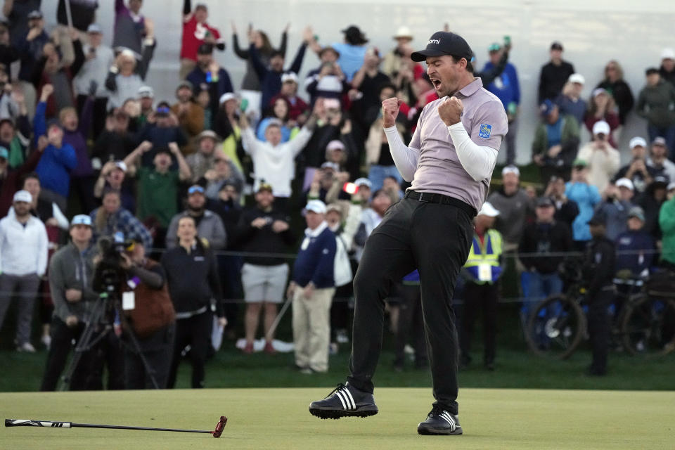 Nick Taylor, of Canada, celebrates after his win over Charley Hoffman on the 18th green on the second playoff hole of the Phoenix Open golf tournament Sunday, Feb. 11, 2024, in Scottsdale, Ariz. (AP Photo/Ross D. Franklin)