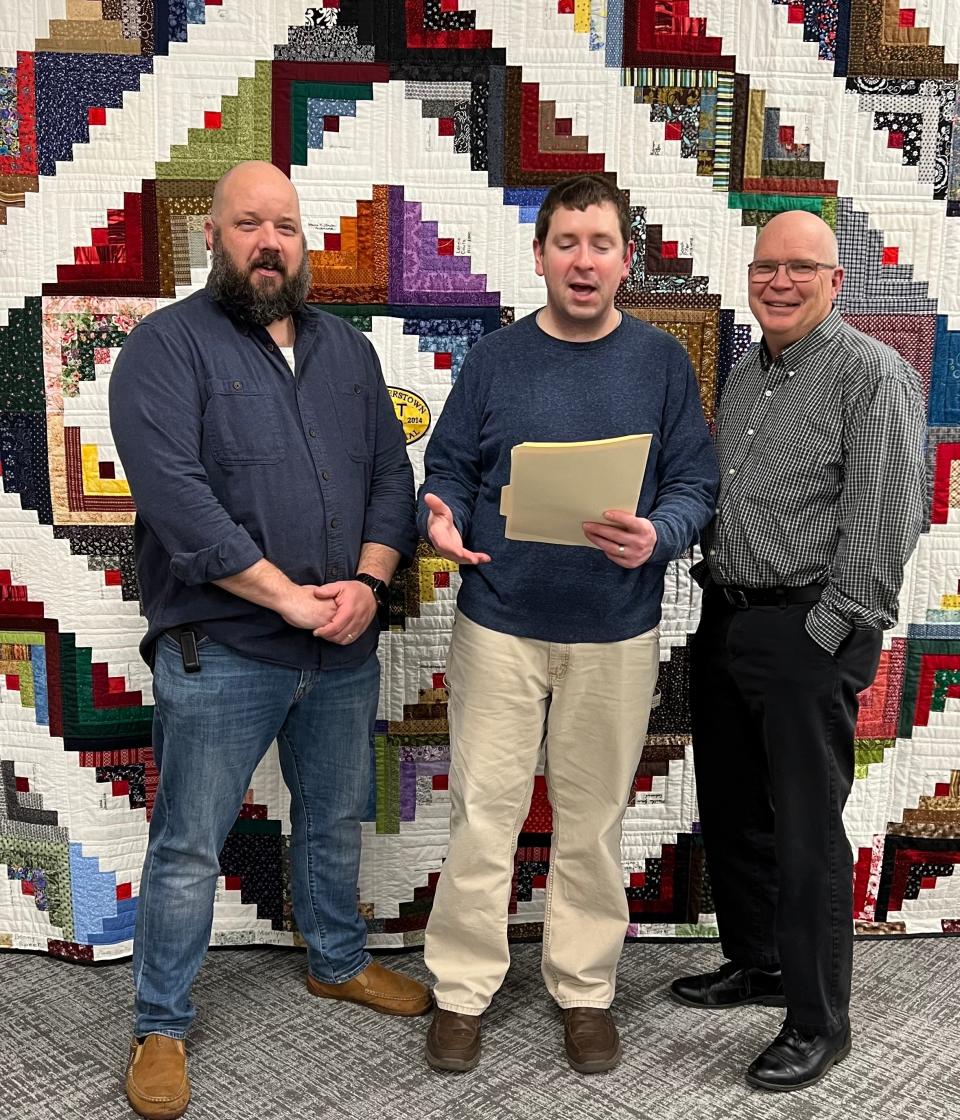 Village Solicitor Mark Perlaky swears in councilman Jay Lambes and Mayor Patrick Cadles for their new terms in office.