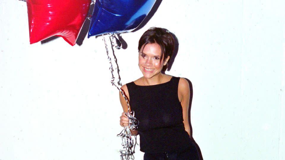 Taken in 1998, after the track "Viva Forever" went to number one in the UK charts, Posh Spice celebrated in another chic top-to-toe black look. - Dave Hogan/Getty Images