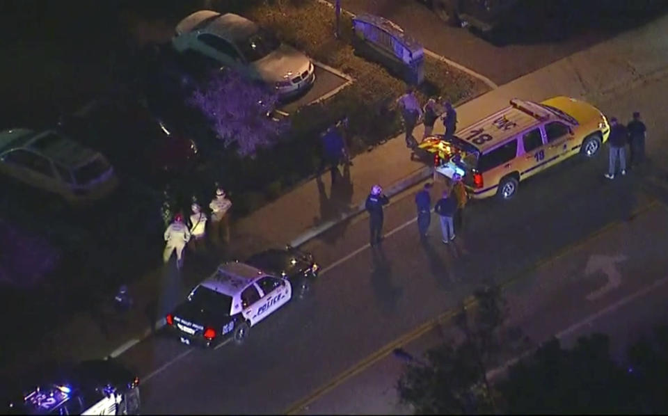 In this image made from aerial video, police vehicles line a road in the vicinity of a mass shooting in Thousand Oaks, California. Source: KABC via AP