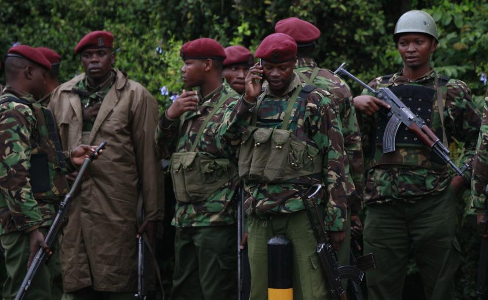 Kenyan policemen gather for a briefing near the Westgate Shopping Centre in the capital Nairobi