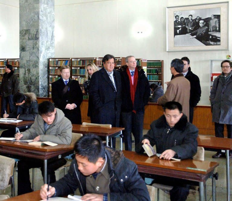 Bill Richardson (C-R) and Eric Schmidt (C-L) at the Grand People's Study House in Pyongyang on Wednesday. Schmidt is part of a "private humanitarian mission" to North Korea led by former New Mexico governor Richardson, which is ostensibly focused on the case of a detained US citizen awaiting trial for alleged crimes against the state