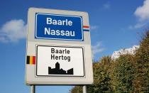 <p>More like a patchwork quilt than a village, the territory of Baarle is shared by Belgium and the Netherlands, with seven Dutch exclaves inside some 22 Belgian exclaves (Baarle-Hertog) scattered across Dutch territory (Baarle-Nassau). Here, the border is quite literal, with white crosses and country indicators running through cafes and homes with seeming abandon. A building’s nationality is determined by the location of the front door. As <a rel="nofollow noopener" href="http://www.npr.org/sections/krulwich/2014/08/05/337795842/how-to-cross-five-international-borders-in-one-minute-without-sweating" target="_blank" data-ylk="slk:NPR hilariously pointed out;elm:context_link;itc:0;sec:content-canvas" class="link ">NPR hilariously pointed out</a>, you can cross five international borders here in just 60 seconds—without breaking a sweat. </p>