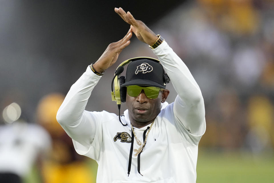 Colorado head coach Deion Sanders calls for a timeout during the second half of an NCAA college football game against Arizona State, Saturday, Oct. 7, 2023, in Tempe, Ariz. Colorado won 27-24. AP Photo/Ross D. Franklin)