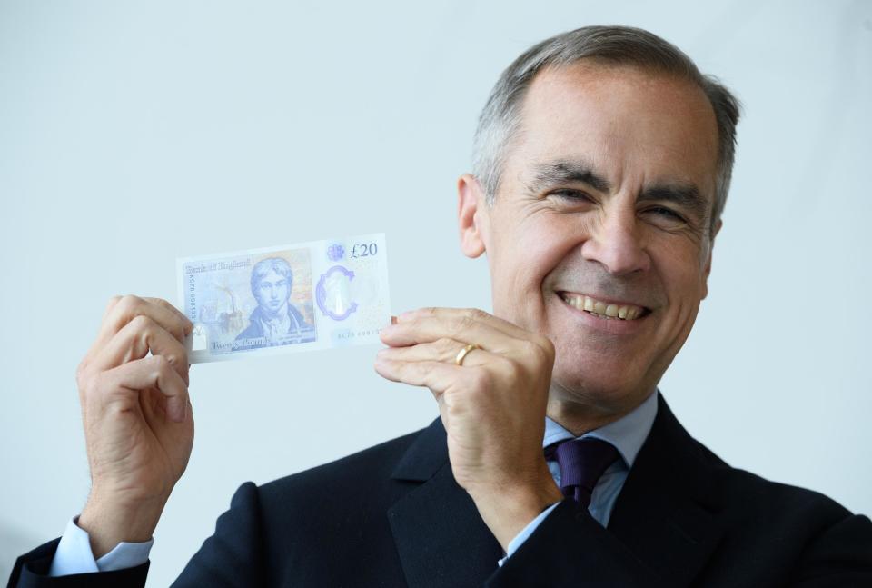 Mark Carney holds up a new £20 note featuring JMW Turner: Leon Neal/Getty Images