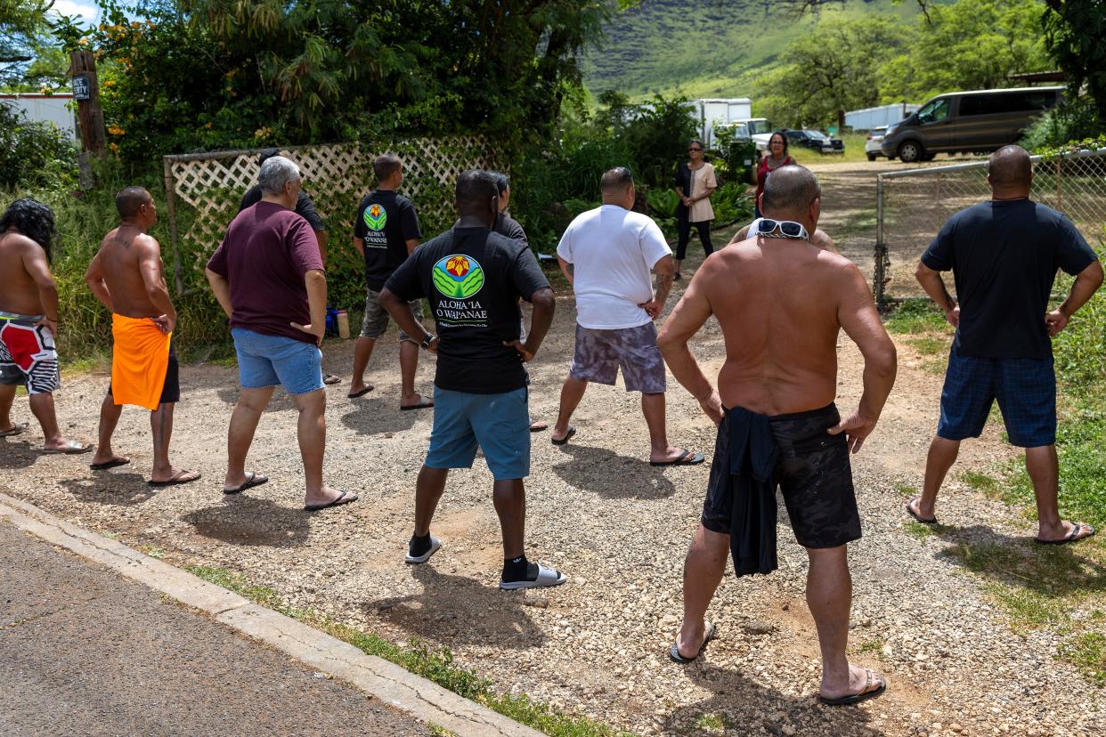 Individuals from the program Ho’omau Ke Ola, which helps native Hawaiian men overcome drug addiction, participate in a traditional ceremony at a retreat in Waianae. June 13, 2024