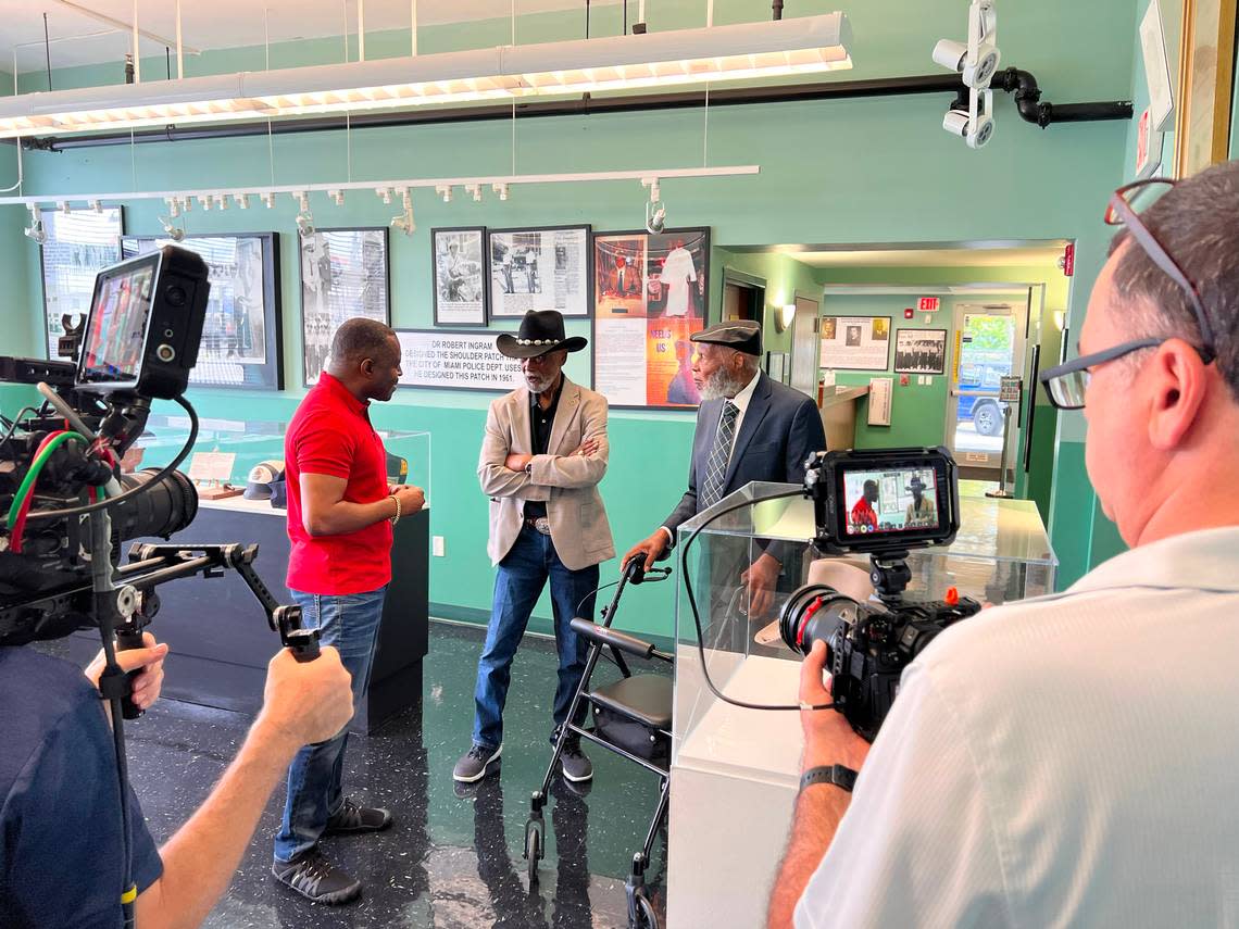 Former Ferguson, Mo. Police Chief Delrish Moss (left) talks with Chief Clarence Dickson (center), Miami’s first Black police chief, and Lt. Archie McKay, an original patrolman inside the Black Police Precinct, during a taping of the documentary “Crossing Overtown.” The documentary will premiere on PBS in late March.