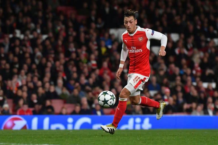 Arsenal's midfielder Mesut Ozil shoots to score his hat trick, and his teams sixth goal, during the UEFA Champions League Group A football match between Arsenal and Ludogorets Razgrad at The Emirates Stadium in London on October 19, 2016