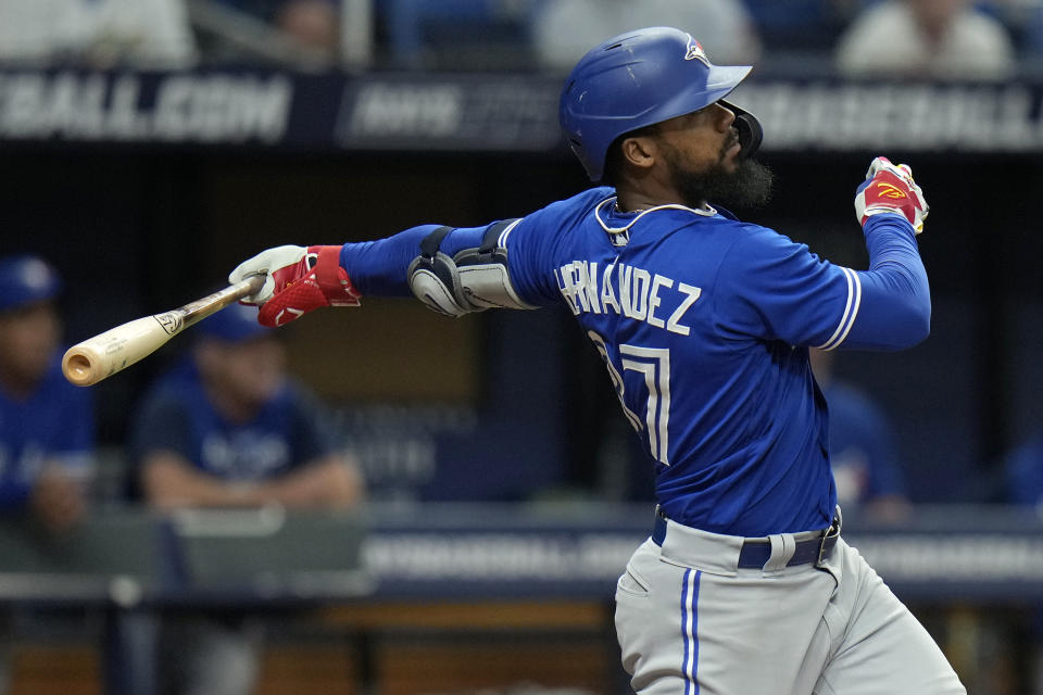 Toronto Blue Jays' Teoscar Hernandez watches his solo home run off Tampa Bay Rays starting pitcher Ryan Thompson during the eighth inning of a baseball game Saturday, May 14, 2022, in St. Petersburg, Fla. (AP Photo/Chris O'Meara)