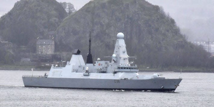 HMS Defender makes it way up the river Clyde past Dumbarton Castle on March 22, 2019 in Glasgow, Scotland