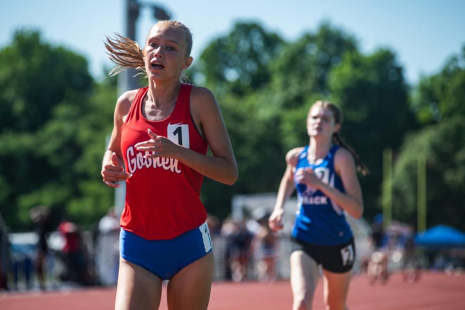 Goshen senior Kayla Schramm wins the girls 1,500-meter run at the Section 9 state qualifying track and field meet on her home track on Friday. Schramm won the race at 4:45:45. KELLY MARSH/For the Times Herald-Record