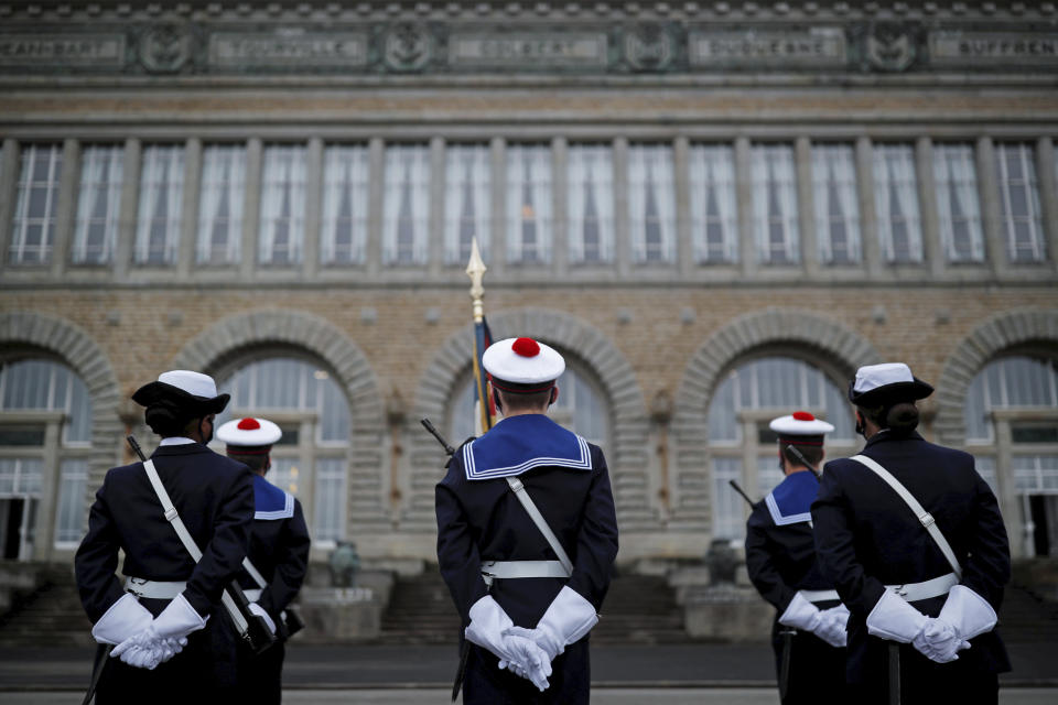 Navy soldiers awaiting French President Emmanuel Macron for a ceremony prior to his New Year's speech to the French Armed Forces at Brest naval training center, western France, Tuesday, Jan. 19, 2021. (Stephane Mahe/Pool Photo via AP)