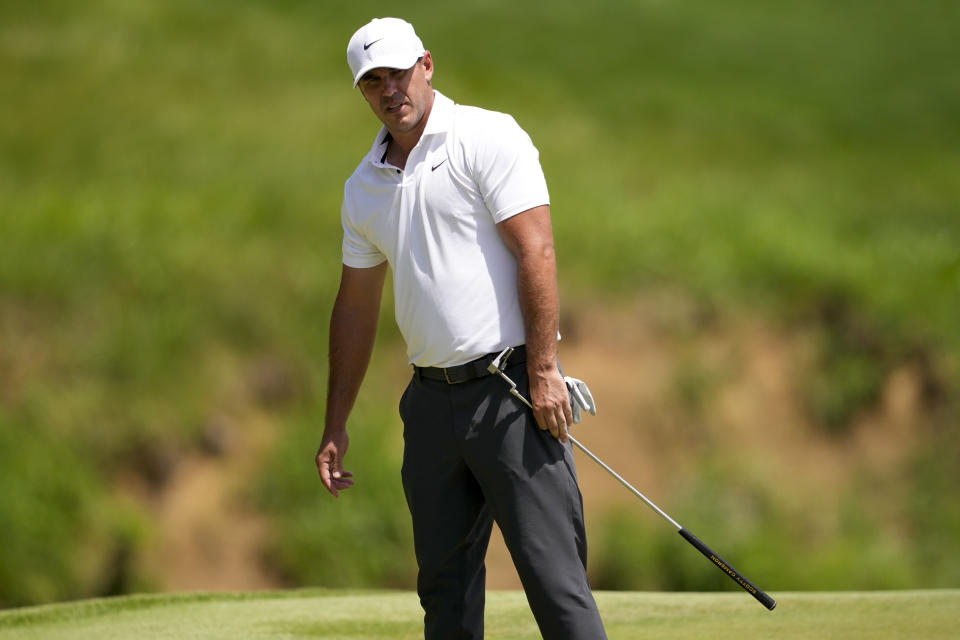 Brooks Koepka reacts after missing a putt on the third hole during the third round of the PGA Championship golf tournament at the Valhalla Golf Club, Saturday, May 18, 2024, in Louisville, Ky. (AP Photo/Matt York)