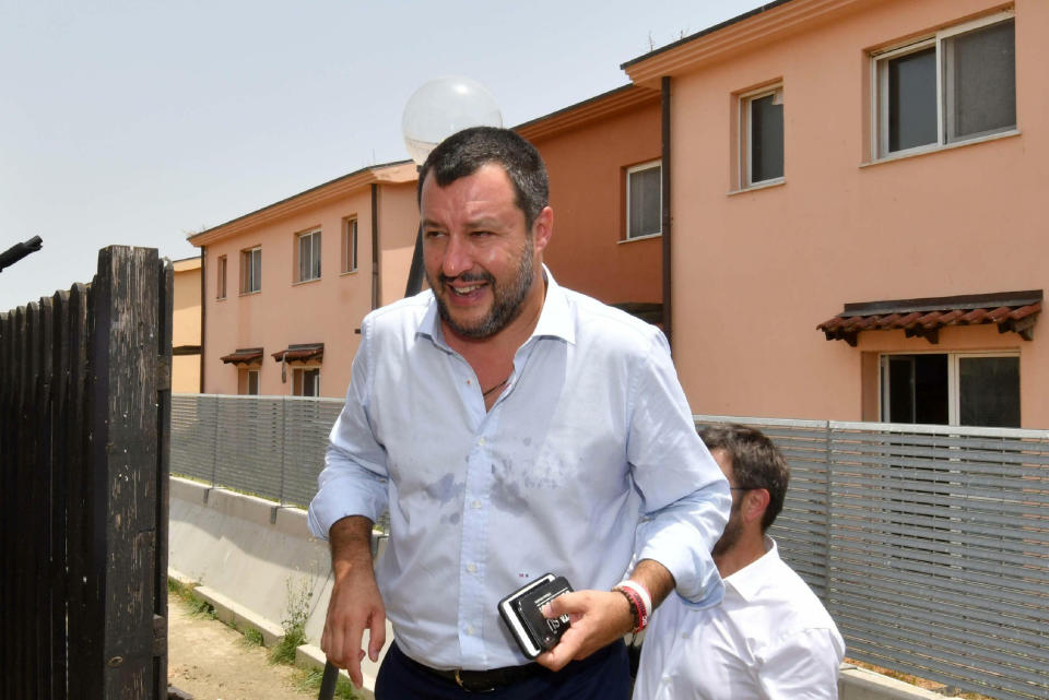 Italian Deputy Premier and Interior Minister, Matteo Salvini, arrives in Mineo, near Catania, southern Italy, Tuesday, July 9, 2019. Italy's hard-line interior minister has closed a migrant center in Sicily that he says was the largest in Europe as he underlined the decrease in migrant arrivals since he took over a year ago. Matteo Salvini has told reporters in Mineo, Sicily that that the number of migrants in centers is down from 182,000 a year ago to 107,000 now. (Orietta Scardino/ANSA via AP)