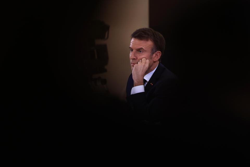 French President Emmanuel Macron listens to a question during his first prime-time news conference to announce his top priorities for the year as he seeks to revitalize his presidency, vowing to focus on "results" despite not having a majority in parliament, Tuesday, Jan. 16, 2024 at the Elysee Palace in Paris. (AP Photo/Aurelien Morissard)