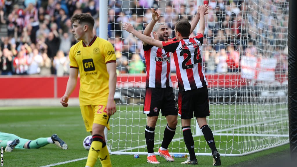 Mikkel Damsgaard and Neal Maupay celebrate Brentford's first goal against Sheffield United in the Premier League