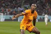 Denzel Dumfries of the Netherlands celebrates scoring his side's 3rd goal during the World Cup round of 16 soccer match between the Netherlands and the United States, at the Khalifa International Stadium in Doha, Qatar, Saturday, Dec. 3, 2022. (AP Photo/Ashley Landis)