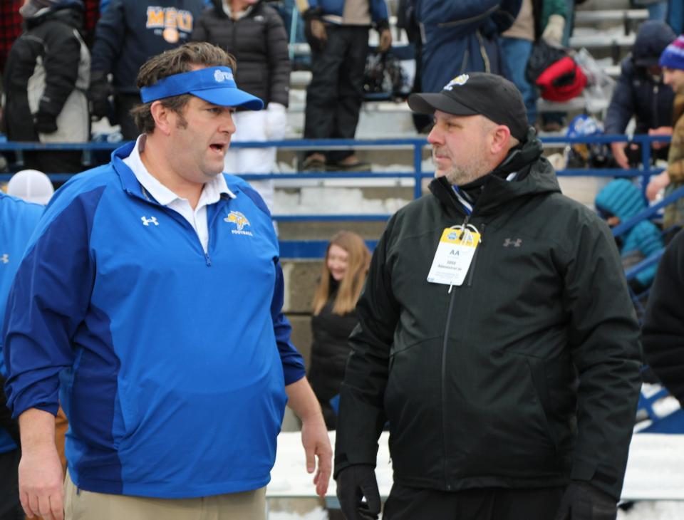 Jason Eck visits with SDSU athletic director Justin Sell moments after the Jacks' semifinal playoff loss to Montana State in 2020. Eck was announced as the new head coach at Idaho later that day.