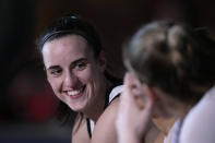 Iowa guard Caitlin Clark sits on the bench during player introductions before a second-round college basketball game against West Virginia in the NCAA Tournament, Monday, March 25, 2024, in Iowa City, Iowa. (AP Photo/Charlie Neibergall)