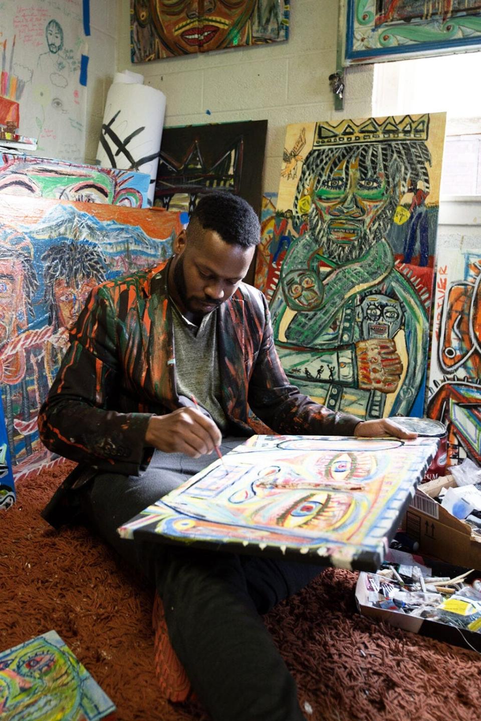 Artist Keto Green works on a new piece. His solo exhibition, "Against It All," debuts Saturday, May 20, 2023 at Playground Detroit.