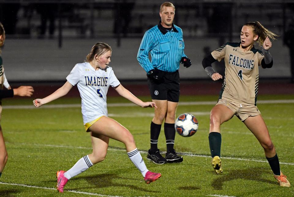 Imagine School's Madison McCombs, on left, and Saint Stephen's Episcopal's Annabelle Pullen go after the ball during Tuesday night's Class 2A-Region 3 girls soccer match at the Moore Athletic Complex at Turner Fields in Bradenton. Saint Stephen's won, 1-0.