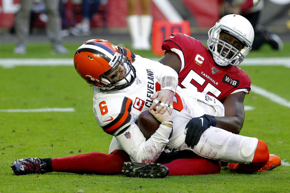 Cleveland Browns quarterback Baker Mayfield (6) is sacked by Arizona Cardinals linebacker Chandler Jones during the first half of an NFL football game, Sunday, Dec. 15, 2019, in Glendale, Ariz. (AP Photo/Rick Scuteri)